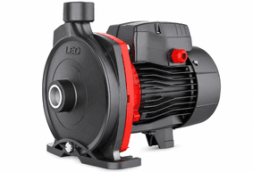 Red and black agricultural water pump on soil